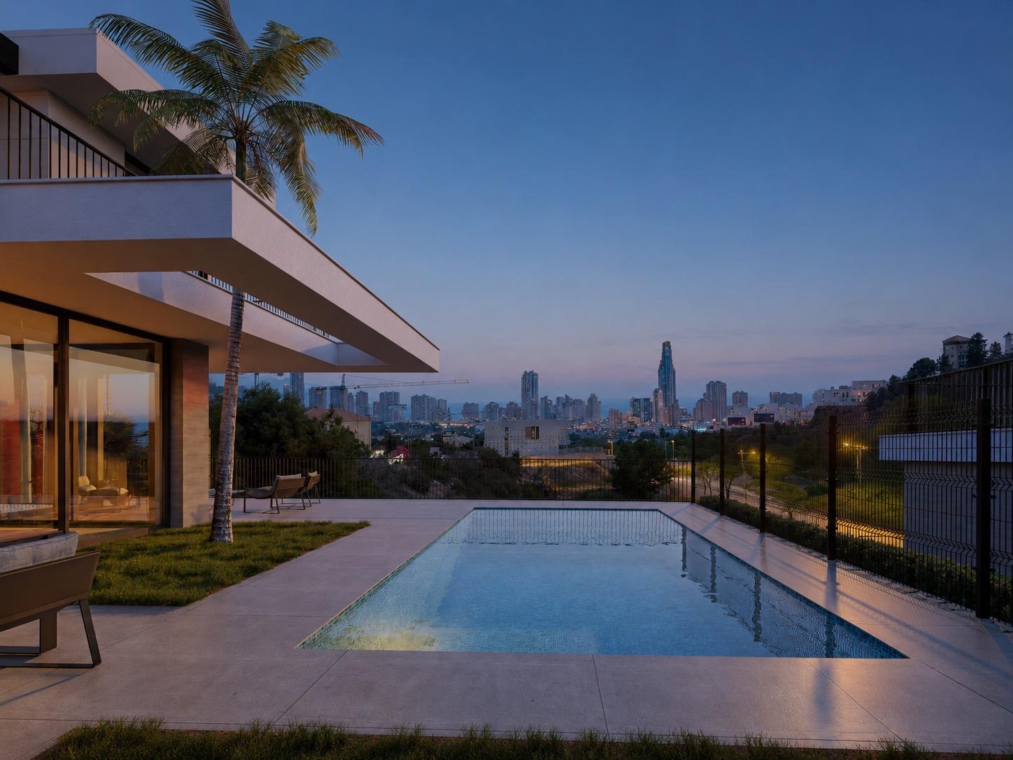 Panoramic dusk view across the pool to the coast